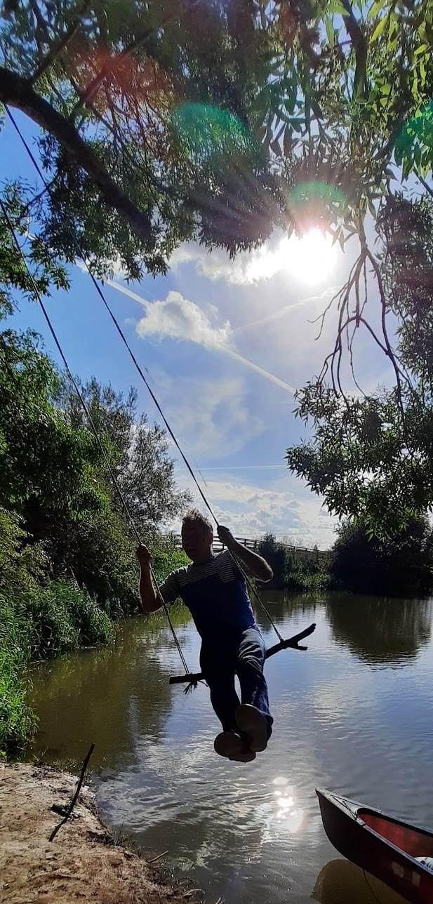 C. M. Taylor on a rope swing over the Thames
